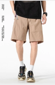 Detail view of khaki ice-skin cargo shorts showing smooth fabric and crisp summer cut