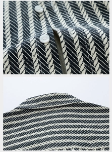 Detail of herringbone denim weave and resin button on high-quality long sleeve shirt