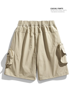 Detail of water-resistant cargo shorts with elastic drawstring waist and side zip pockets