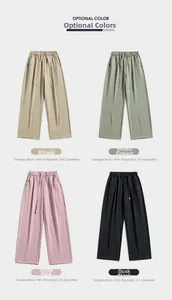 Close-up of lightweight drawstring trousers in Khaki, Green, Pink, and Black colors