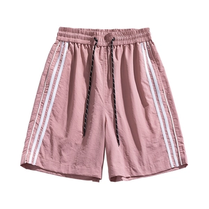 Pantaloncini sportivi rosa ad asciugatura rapida con strisce bianche e cordino in vita