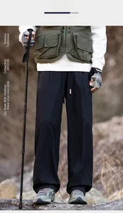 Outdoor view of lightweight black straight-leg trousers for hiking and camping lifestyle