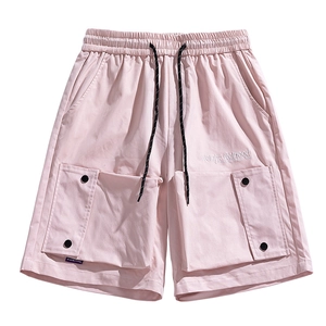 Light pink water-resistant cargo shorts with drawstring waist and tactical side pockets