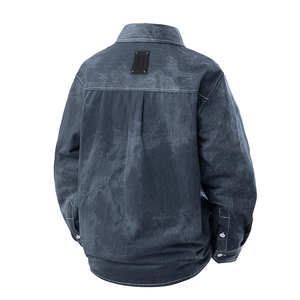 Deep blue denim jacket with signature four-stitch white embroidery on the back yoke