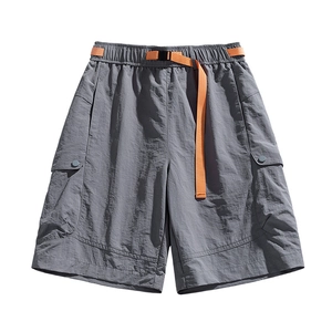 Deep grey techwear cargo shorts with quick-dry texture and vibrant orange buckle belt