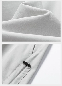 Macro detail of high-density grey fabric showing double stitching and premium fasteners
