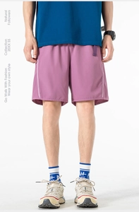 Detail view of purple quick-dry shorts featuring side panels and adjustable waist belt