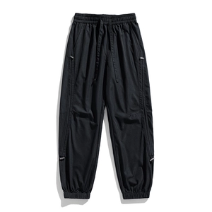 Men's black cargo jogger pants with elastic drawstring waist and side zippers