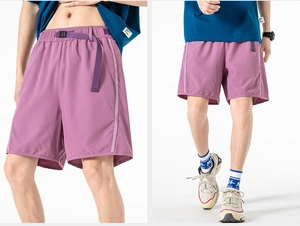 Detail of lavender cargo shorts featuring a built-in nylon belt and quick-dry fabric texture