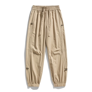 Men's khaki cargo pants with drawstring waist and zip details for outdoor hiking