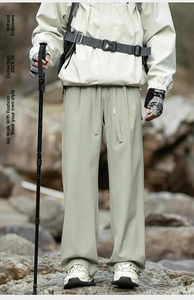 Outdoor functional hiking pants in sage green with windproof fabric and relaxed straight fit