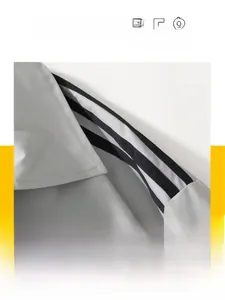 Detail of grey casual jacket with black contrast stripes on sleeves and ribbed cuff