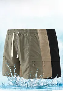 Detail of breathable quick-dry cargo shorts with elastic drawstring waist and side pockets