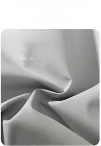 Detailed macro view of 100% polyester light grey windproof and wrinkle-resistant jacket fabric