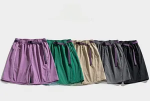 Detail showing multi-color quick-dry cargo shorts with adjustable buckle belts