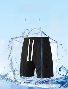 Detail of black nylon cargo shorts with elastic waistband and cooling fabric texture
