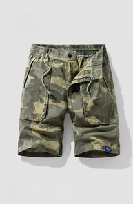 Detailed view of camouflage cargo shorts showing elastic waistband, drawstring and button closure