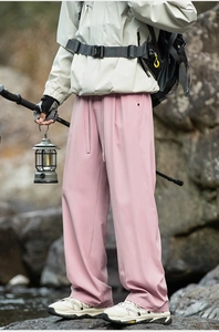 Detail of pink lightweight hiking trousers with drawstring waist and straight-leg design