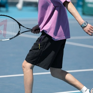Men's sports set with a purple loose T-shirt and black quick-dry shorts for summer style