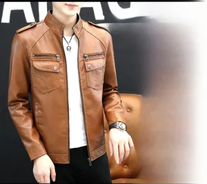Detailed view of a brown faux leather biker jacket with shoulder straps and utility pockets