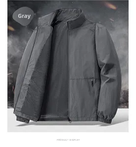 Detail of gray outdoor jacket showing the breathable mesh lining and durable nylon zipper