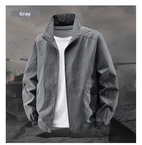 Detail of gray lightweight windproof tactical jacket with stand collar and zipper pockets