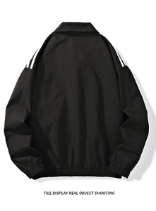 Back view of black jacket showing white triple stripes on shoulders and ribbed cuffs