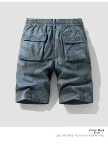 Detail view of elastic waistband and large back pockets on blue camouflage cargo shorts