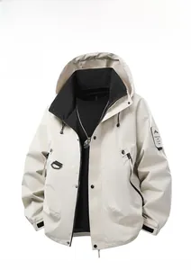 Detail of off-white hooded jacket featuring velcro cuffs and decorative arm patch