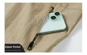 Close-up of khaki jacket zipper pocket showing ample storage space for a smartphone