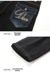 Details der schwarzen Denim-Tasche mit blauem Kontrast und goldener Stickerei