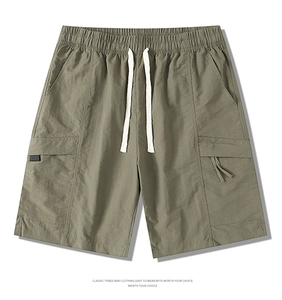 Detail of cargo shorts waist with elastic band and adjustable white drawstrings