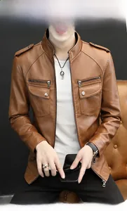 Detailed close-up of brown PU leather biker jacket with shoulder epaulettes and silver zippers