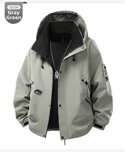 Detail of gray-green outdoor jacket featuring hood drawstrings and tactical sleeve patch