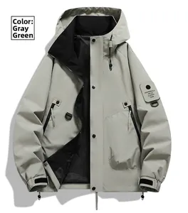 Detail of grey-green outdoor jacket featuring adjustable drawstring hood and black lining