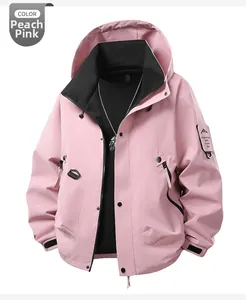 Peach pink hooded outdoor jacket with mountain patch and adjustable velcro cuffs