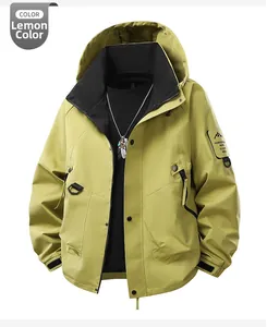 Detail of lemon yellow outdoor jacket featuring high-collar hood and brand sleeve patch