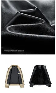 Detailed view of men's leather jacket showing lychee texture and fleece lining options