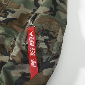 Classic camouflage MA1 bomber jacket featuring detailed sleeve pocket and red flight tag