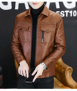 Detailed close-up of brown biker jacket featuring symmetrical chest pockets and metal zipper