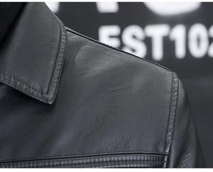 Macro shot of precise stitching on black leather motorcycle jacket collar and shoulder
