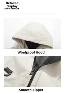 Detail of windproof drawstring hood and smooth resin zipper on a beige outdoor jacket