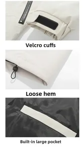 Detail of adjustable velcro cuffs, drawstring hem and inner pocket on beige jacket