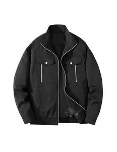 Close-up of black cargo jacket with chest flap pockets and metallic zipper details
