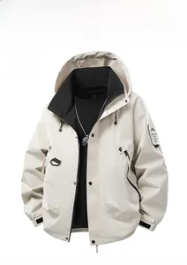 Detail of off-white hooded jacket featuring black lining, side zip pockets and mountain patch