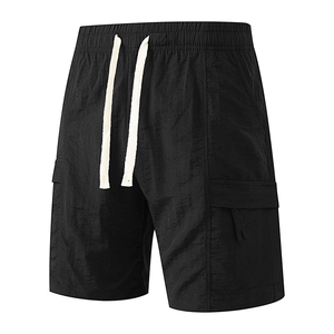 Men's black nylon cargo shorts with elastic waist and drawstring on white background