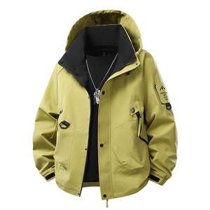 Men's mustard green waterproof outdoor jacket with hood and mountain sleeve patch