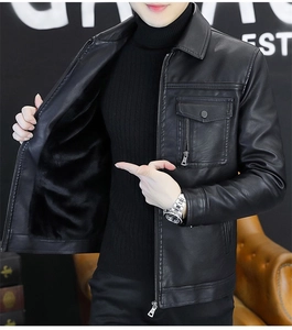Close-up of black leather jacket featuring thick plush lining and metal zipper details
