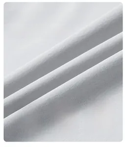 Detail of grey ice silk sport pants fabric showing high elasticity and breathable texture