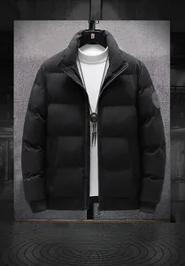 Detail of men's black padded winter jacket featuring ribbed windproof cuffs and stand collar
